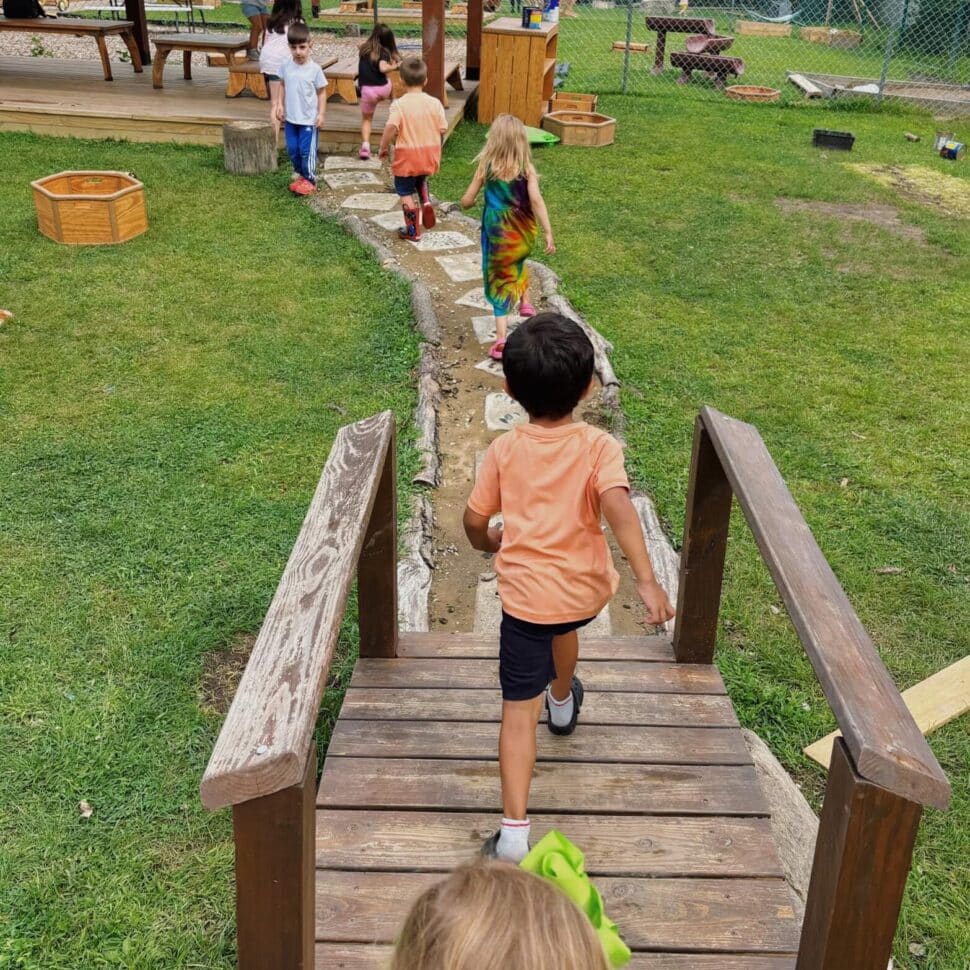 Children exploring the natural outdoor classroom at Green Garden Macomb