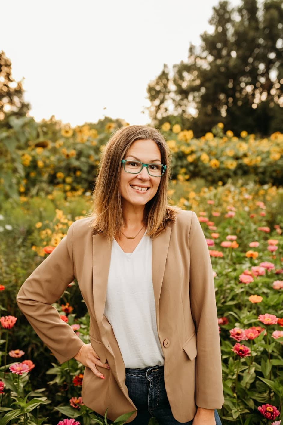 Erica Kral outdoors among flowers
