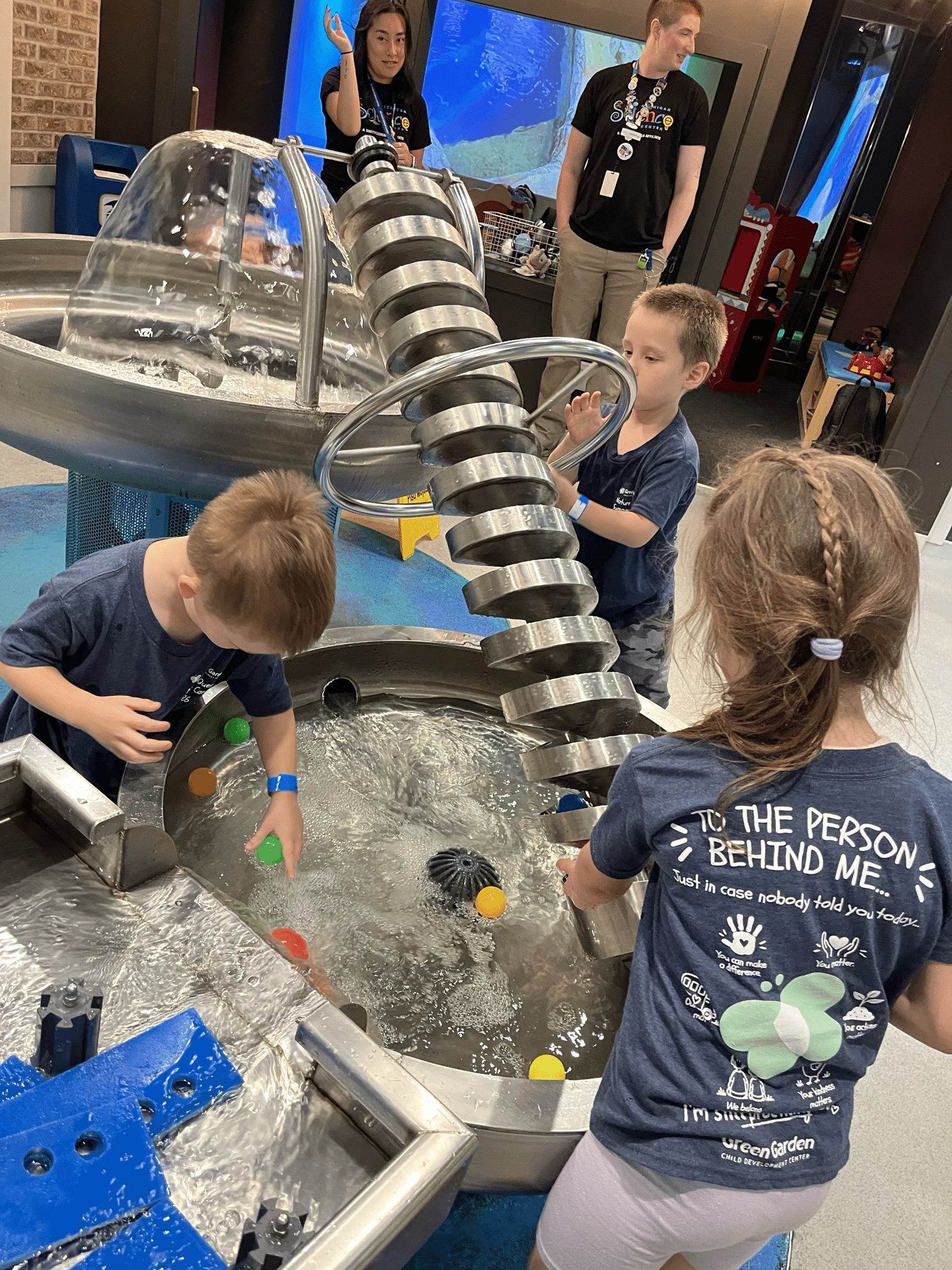 Green Garden campers explore a water exhibit during a field trip