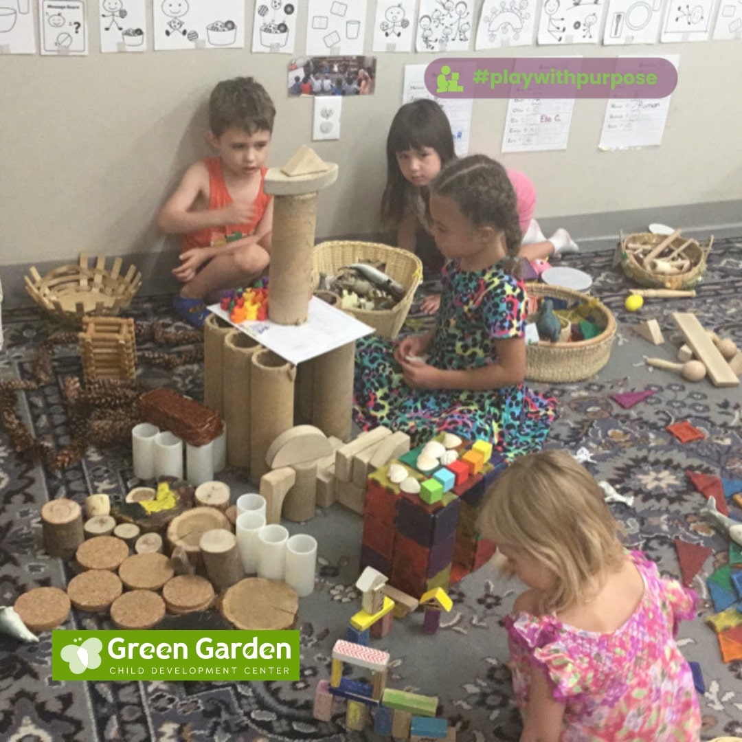 Children building together with wood slices, blocks, tubes, baskets, and other open-ended materials